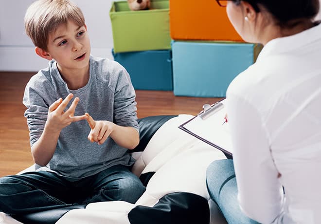 Child talking with counselor